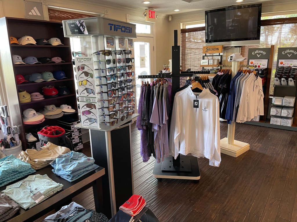 eyewear and shirt racks inside the proshop