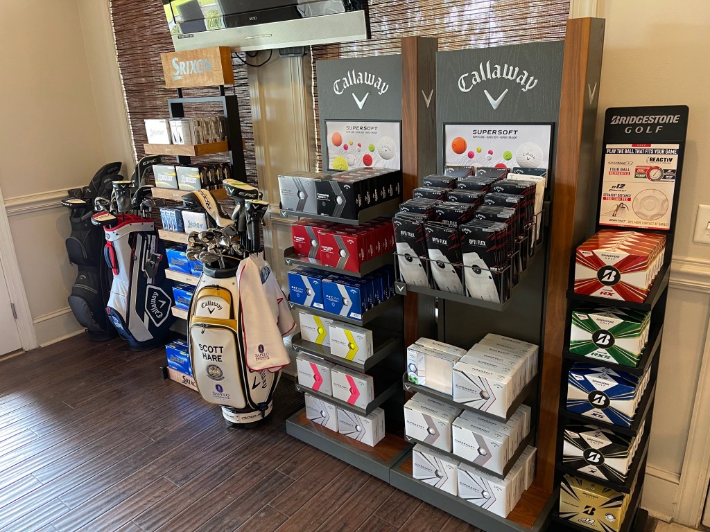 assortment of golfer equipment at the proshop